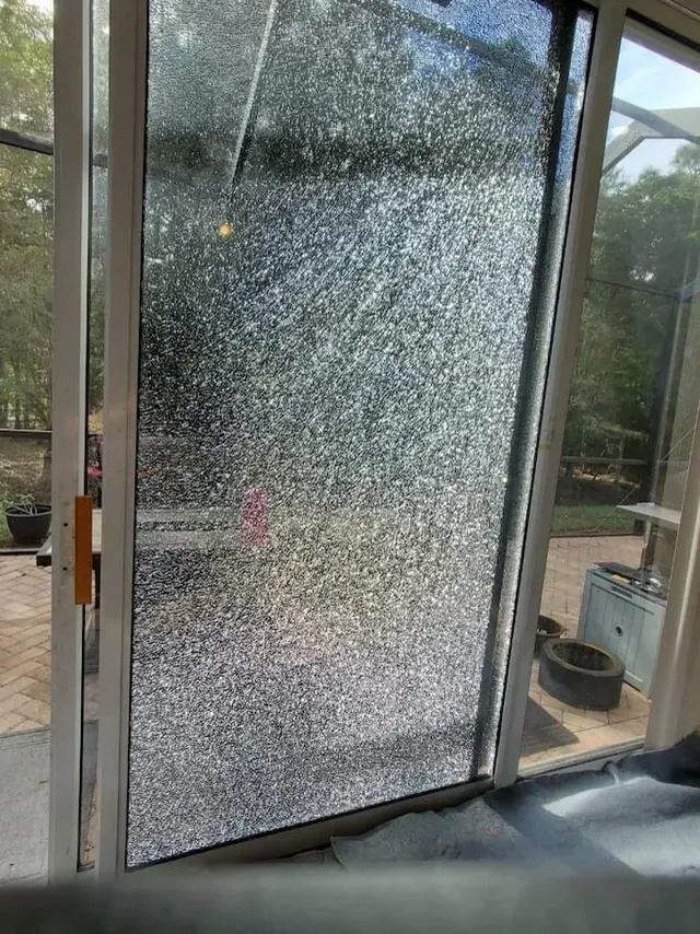 Dirty sliding door track packed with debris before cleaning